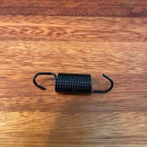 Spring for spare wheel carrier latch