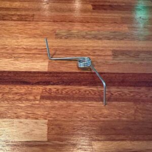 Kick vent spring left