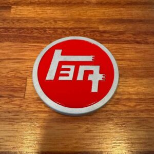 Red TEQ aluminium grill badge