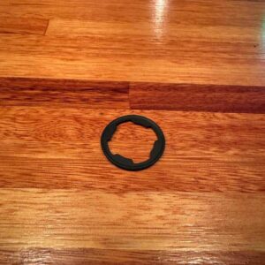 Rubber pad behind outside door lock