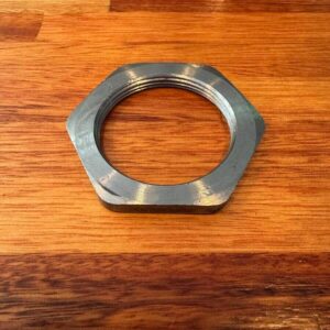 Front axle hub adjusting nut