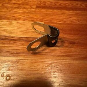 Brake line clamp with plastic to chassis